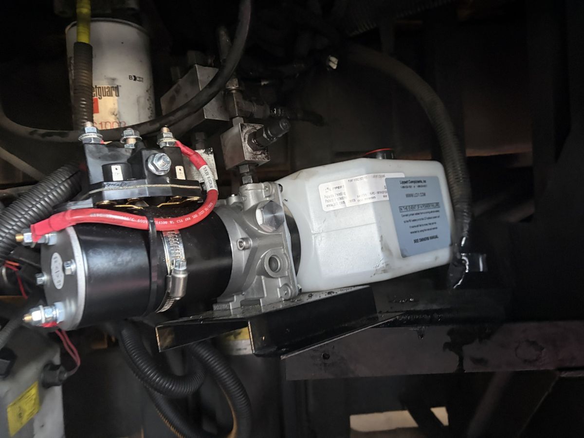 Lippert hydraulic leveling pump under a coach